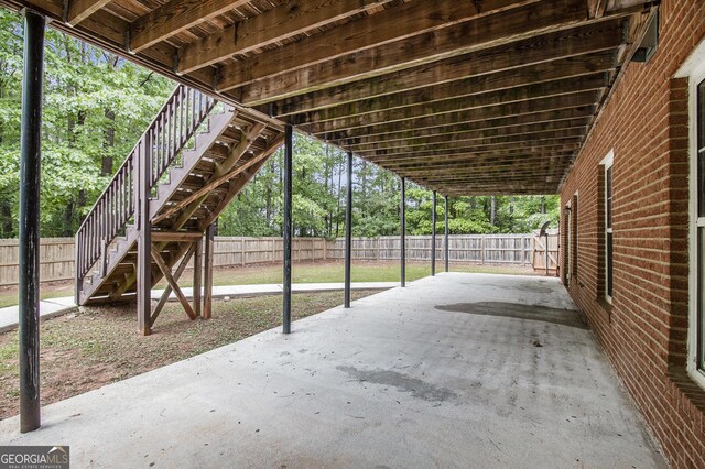 1085 Crown River Pkwy, Mcdonough, GA 30252 - view of yard with stairway, a patio, a sunroom, and a fenced backyard