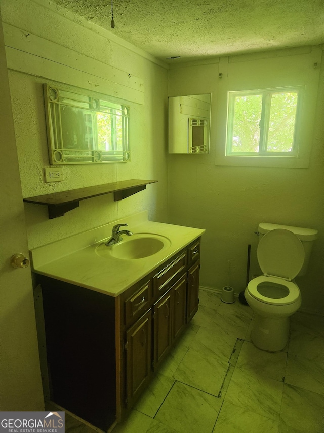 4 Maple St, Porterdale, GA 30014 - bathroom featuring vanity, a textured ceiling, and toilet