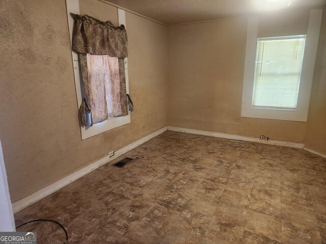 4 Maple St, Porterdale, GA 30014 - empty room featuring visible vents and baseboards