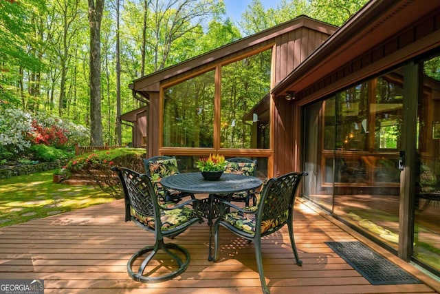 deck featuring outdoor dining area