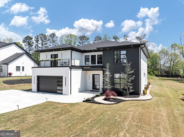 view of front of house featuring a balcony, concrete driveway, stucco siding, a front yard, and a garage