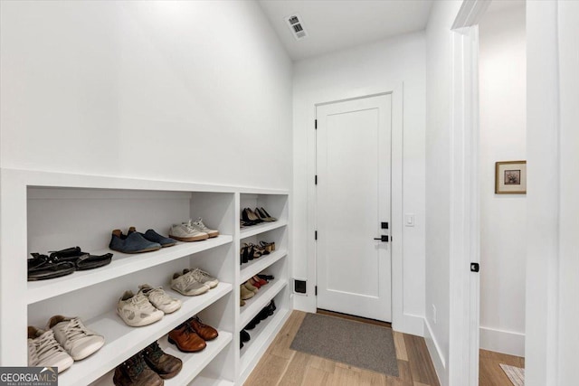 mudroom featuring visible vents and light wood-style flooring