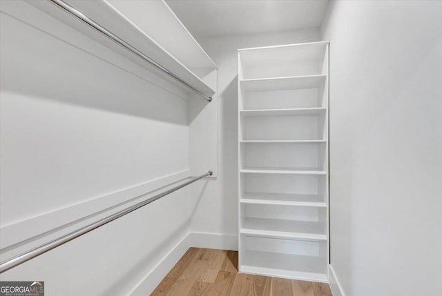 walk in closet featuring light wood-style flooring