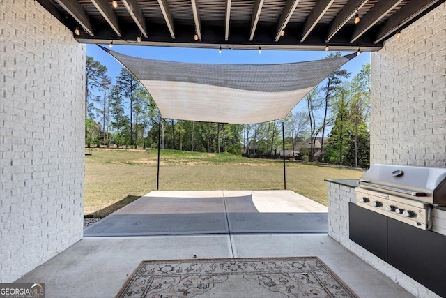 view of patio with a grill and exterior kitchen