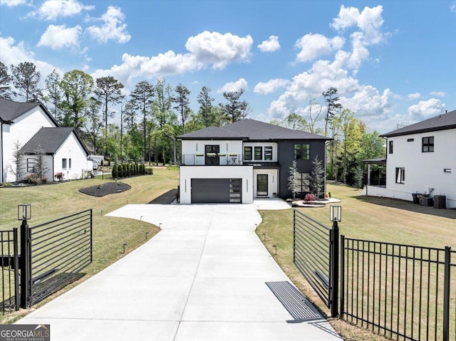 view of front facade with a front lawn, driveway, fence, a garage, and stucco siding