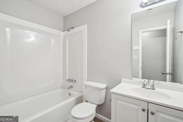bathroom with shower / bath combination, a textured ceiling, vanity, and toilet