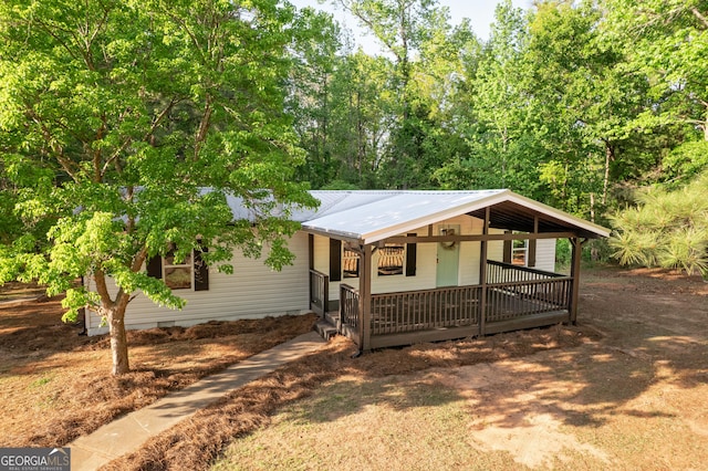 216 Howard Rd, Barnesville, GA 30204 - single story home with a porch, metal roof, and crawl space