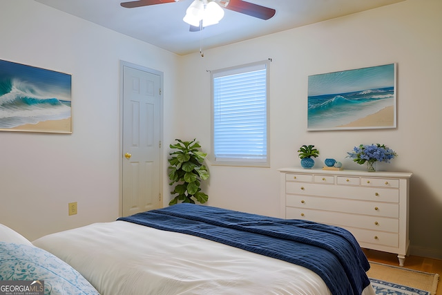 1166 Memory Ln, Lawrenceville, GA 30044 - bedroom featuring wood finished floors, a ceiling fan, and baseboards