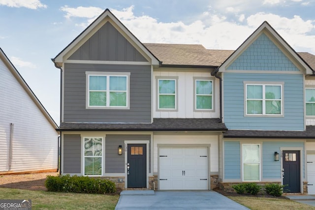 130 Magnolia Pl, Homer, GA 30547 - view of property featuring board and batten siding, driveway, a shingled roof, and an attached garage