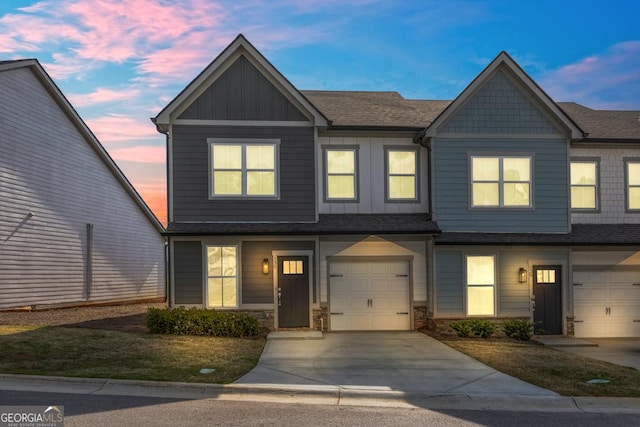 130 Magnolia Pl, Homer, GA 30547 - townhome / multi-family property with board and batten siding, driveway, an attached garage, and roof with shingles