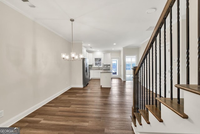 130 Magnolia Pl, Homer, GA 30547 - interior space featuring stainless steel fridge, ornamental molding, decorative backsplash, white cabinets, and dark wood-style flooring