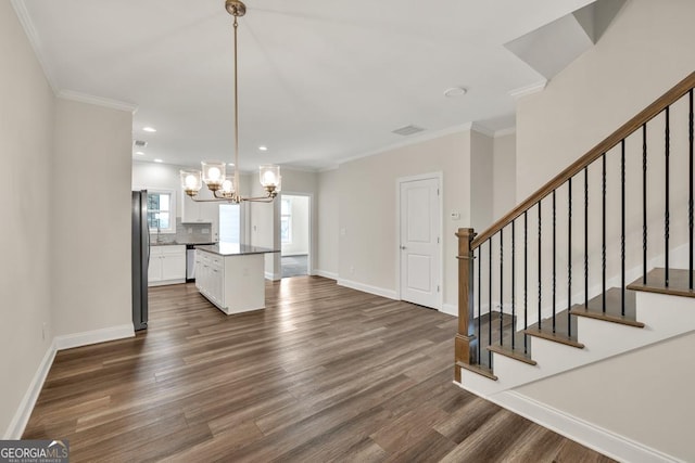 130 Magnolia Pl, Homer, GA 30547 - kitchen with freestanding refrigerator, a chandelier, white cabinets, dark wood-style floors, and backsplash