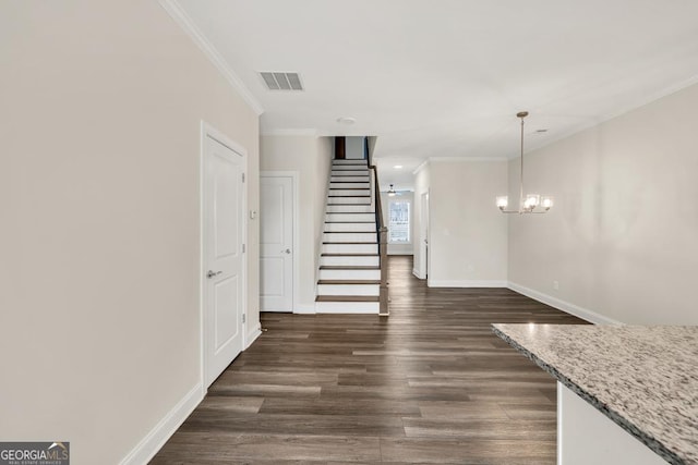 130 Magnolia Pl, Homer, GA 30547 - unfurnished living room featuring ornamental molding, stairway, dark wood-style flooring, and a chandelier