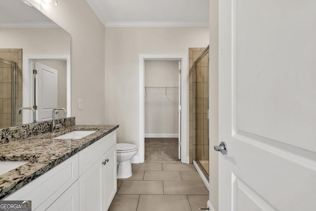 130 Magnolia Pl, Homer, GA 30547 - full bathroom with a stall shower, double vanity, ornamental molding, tile patterned flooring, and a spacious closet