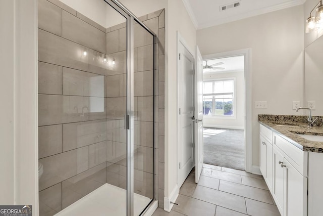 130 Magnolia Pl, Homer, GA 30547 - bathroom with ornamental molding, double vanity, a shower stall, and tile patterned flooring