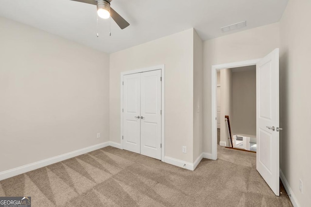 130 Magnolia Pl, Homer, GA 30547 - unfurnished bedroom with carpet floors, a closet, and a ceiling fan