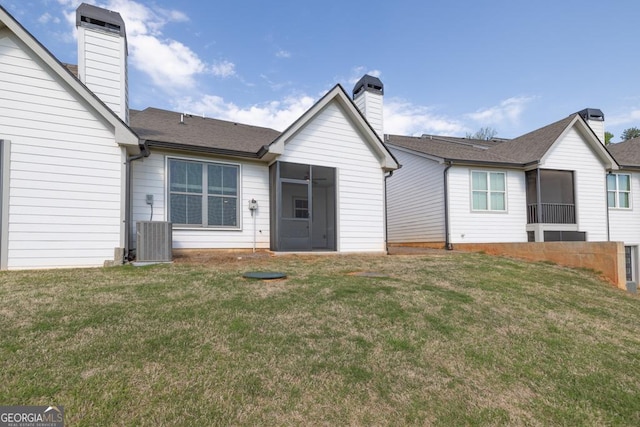 130 Magnolia Pl, Homer, GA 30547 - back of house with a sunroom, a chimney, and a lawn