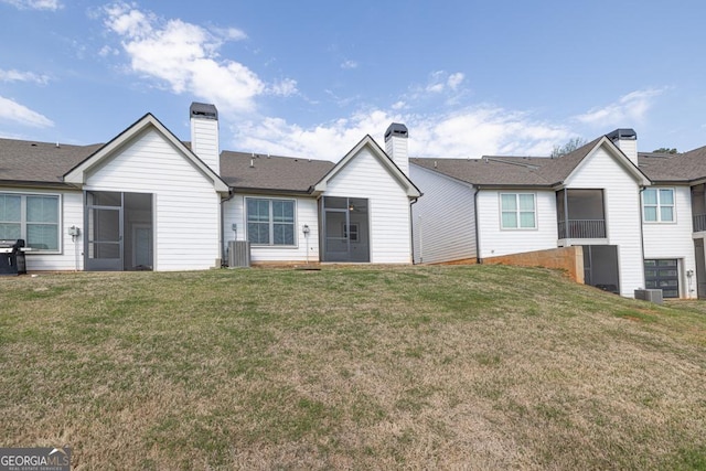 130 Magnolia Pl, Homer, GA 30547 - back of house with a sunroom, a yard, and a chimney