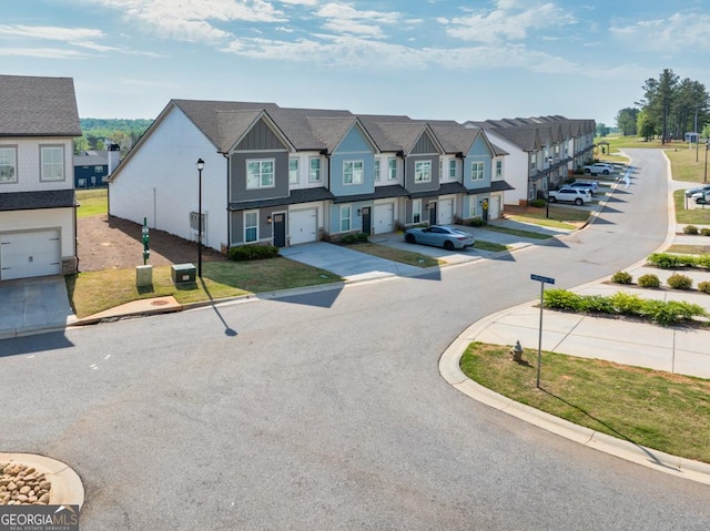 130 Magnolia Pl, Homer, GA 30547 - view of asphalt road with curbs, a residential view, and street lighting