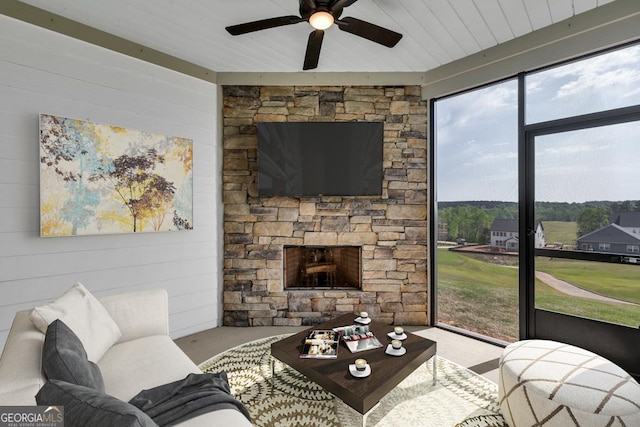 130 Magnolia Pl, Homer, GA 30547 - carpeted living room featuring ceiling fan, a fireplace, and wood walls