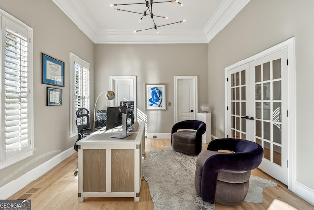home office featuring light wood-type flooring, french doors, visible vents, and crown molding