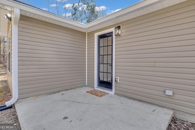 entrance to property with a patio