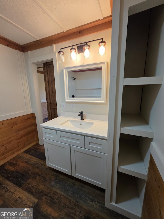 bathroom with vanity and wood finished floors