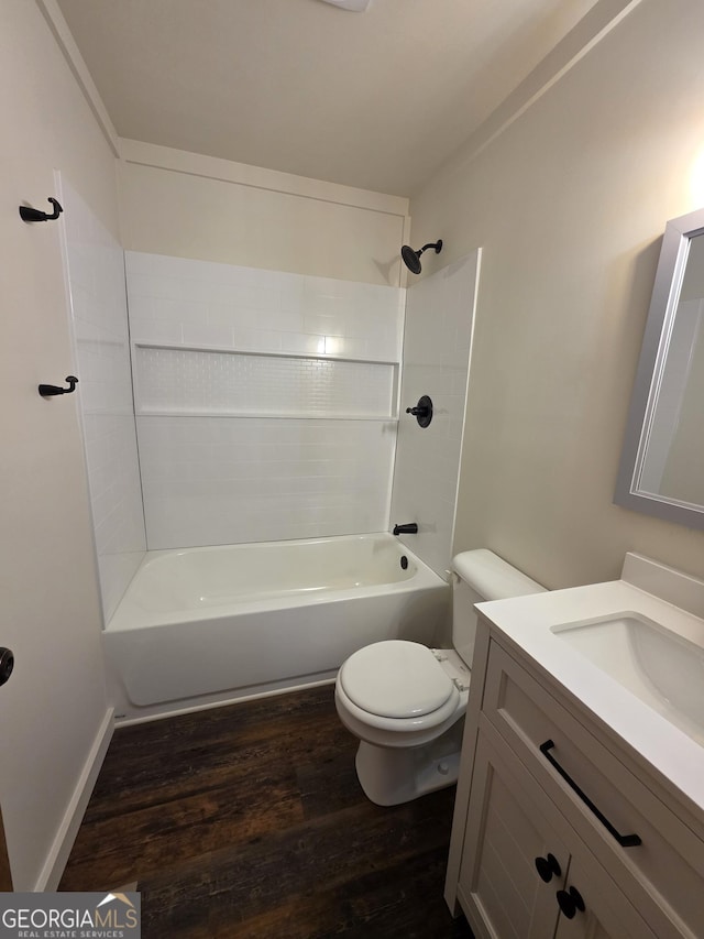 full bathroom featuring shower / washtub combination, wood finished floors, vanity, and toilet