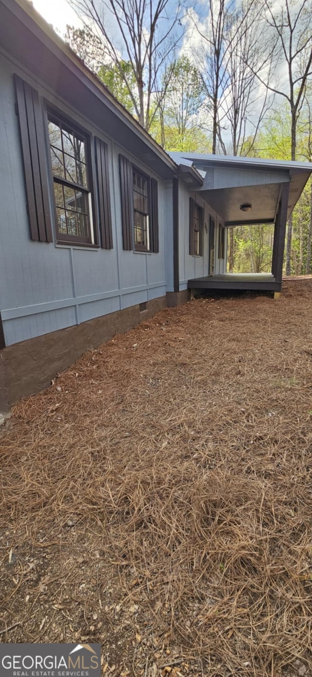view of side of property with crawl space