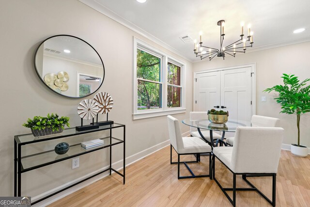 1186 Thomas Rd, Decatur, GA 30030 - dining space with a chandelier, crown molding, baseboards, light wood finished floors, and recessed lighting