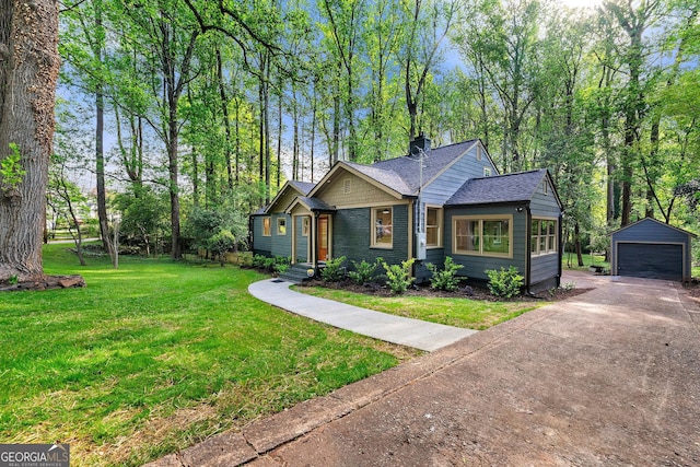 1186 Thomas Rd, Decatur, GA 30030 - view of front of home with an outbuilding, a garage, a chimney, a front yard, and a shingled roof
