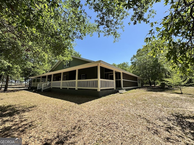 rear view of house with a sunroom