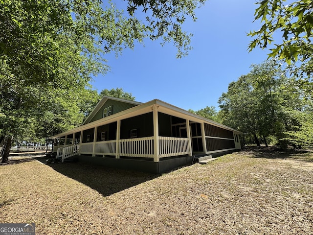 view of home's exterior featuring covered porch