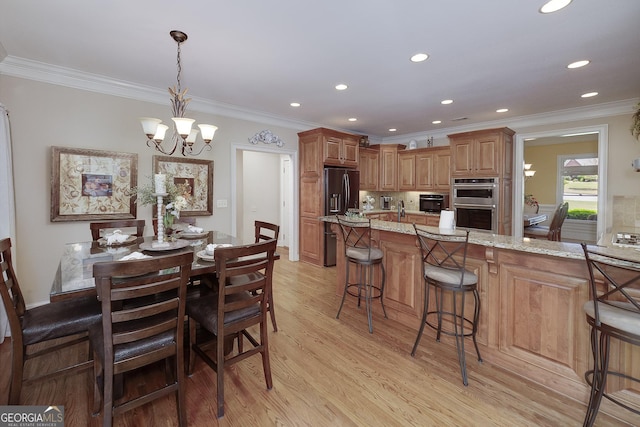 330 Noah Pl, Mcdonough, GA 30252 - dining area featuring a chandelier, recessed lighting, crown molding, and light wood finished floors