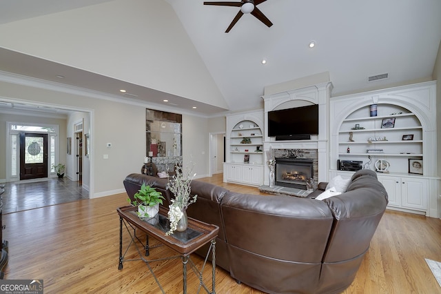 330 Noah Pl, Mcdonough, GA 30252 - living area featuring a fireplace, ceiling fan, high vaulted ceiling, visible vents, and baseboards