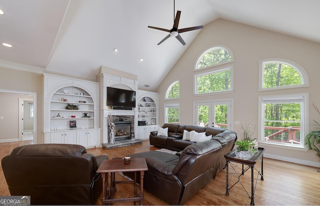 330 Noah Pl, Mcdonough, GA 30252 - living room with light wood-type flooring, high vaulted ceiling, a ceiling fan, and a fireplace