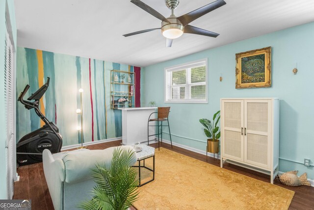 1954 Timothy Dr NE, Atlanta, GA 30329 - living area featuring wood finished floors, a ceiling fan, baseboards, wallpapered walls, and stairs