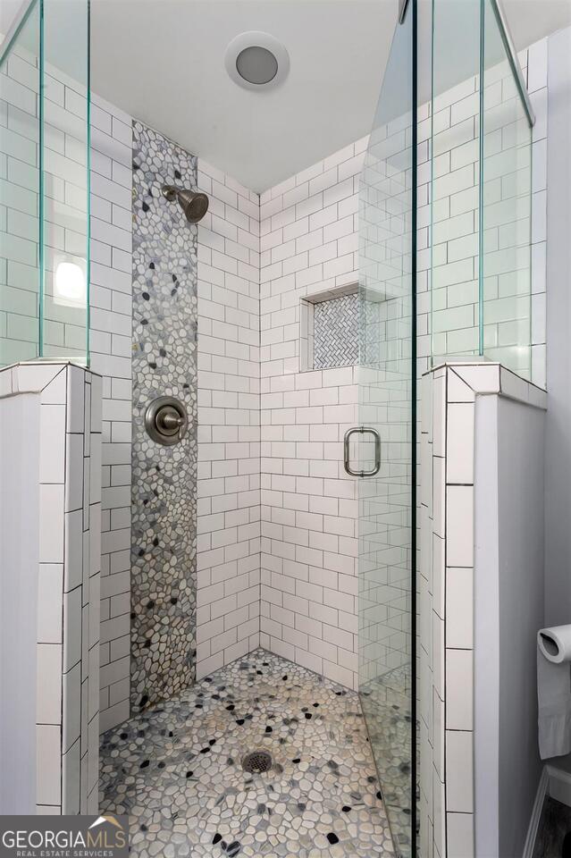 1954 Timothy Dr NE, Atlanta, GA 30329 - bathroom featuring a stall shower, wood finished floors, ceiling fan, and vanity