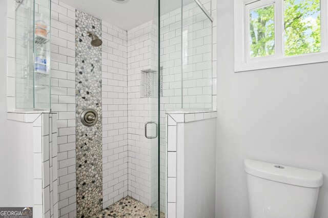 1954 Timothy Dr NE, Atlanta, GA 30329 - bedroom featuring wood finished floors, a closet, ceiling fan, and baseboards