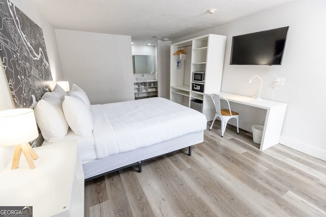 450 Warren Mason Blvd, Brunswick, GA 31520 - bedroom featuring light wood finished floors and baseboards