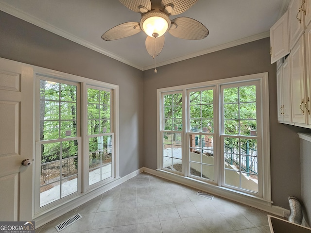 doorway to outside with baseboards, visible vents, and a wealth of natural light