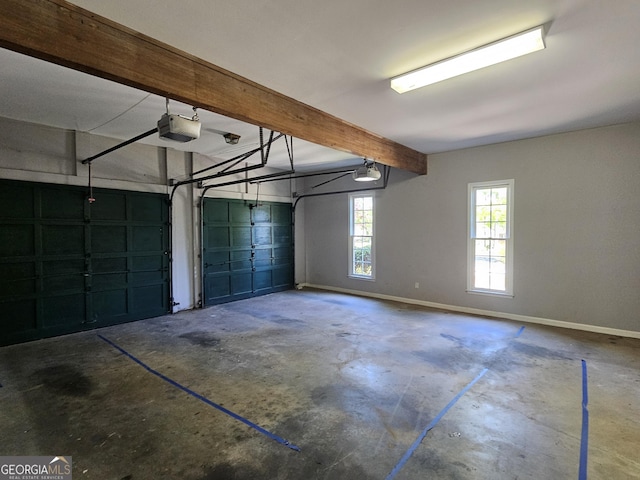garage featuring baseboards and a garage door opener
