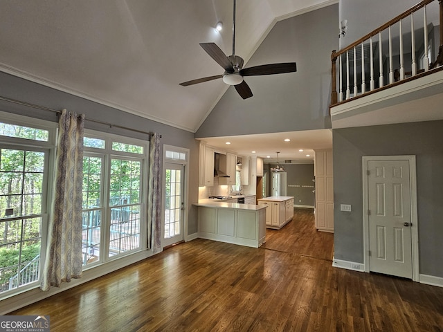unfurnished living room with a ceiling fan, baseboards, high vaulted ceiling, and dark wood-style flooring