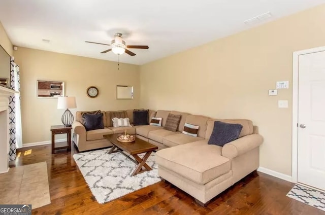 2 Hillshire Dr, Newnan, GA 30263 - living area with ceiling fan, baseboards, a fireplace with flush hearth, and wood finished floors