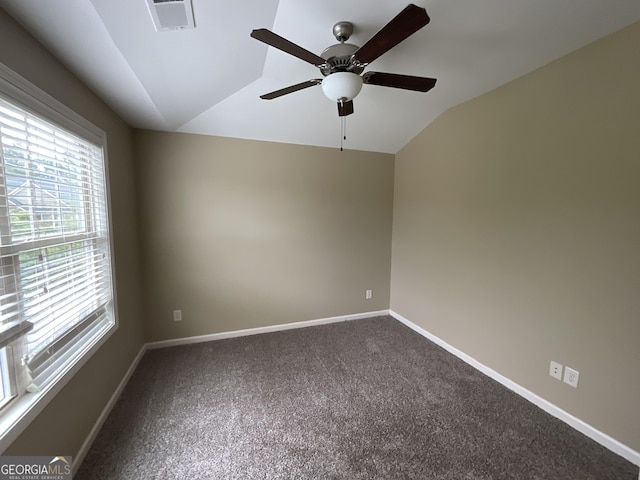 2 Hillshire Dr, Newnan, GA 30263 - empty room with lofted ceiling, a ceiling fan, visible vents, and dark carpet