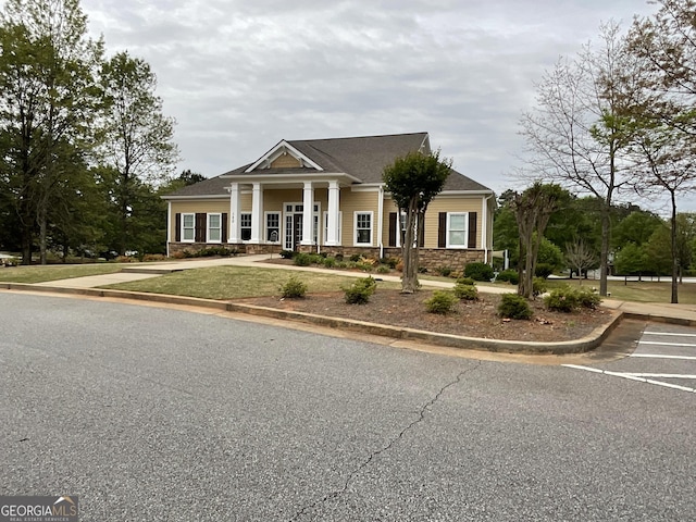 2 Hillshire Dr, Newnan, GA 30263 - neoclassical / greek revival house featuring stone siding and a front yard