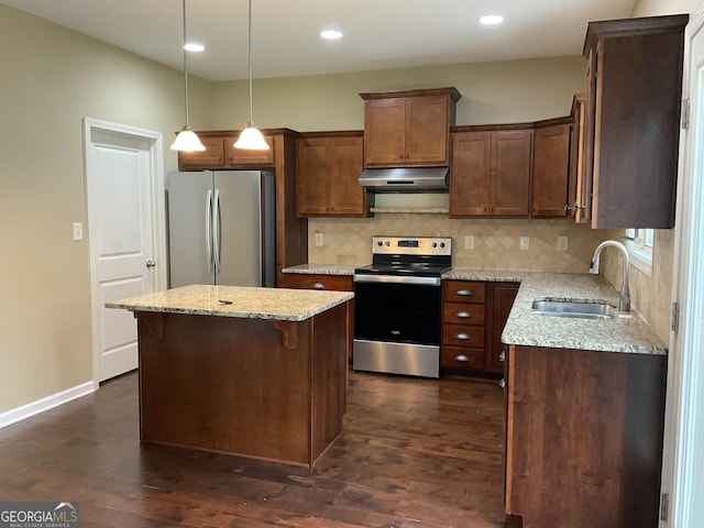 2 Hillshire Dr, Newnan, GA 30263 - kitchen featuring a sink, tasteful backsplash, dark wood finished floors, under cabinet range hood, and appliances with stainless steel finishes