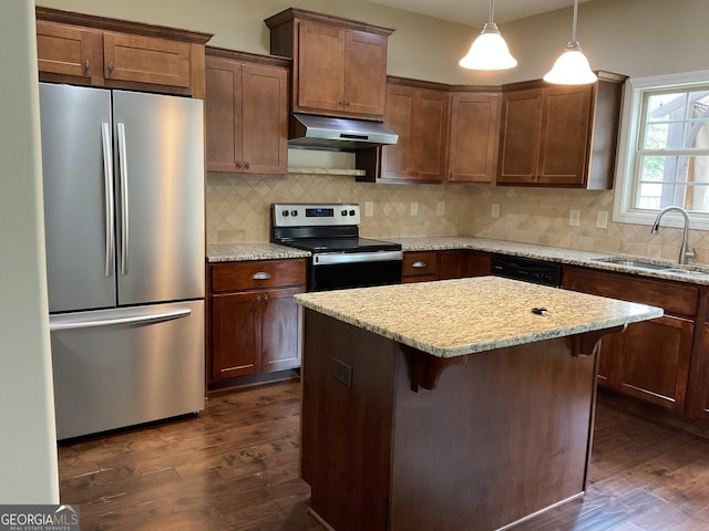 2 Hillshire Dr, Newnan, GA 30263 - kitchen with under cabinet range hood, dark wood-style flooring, a sink, and appliances with stainless steel finishes