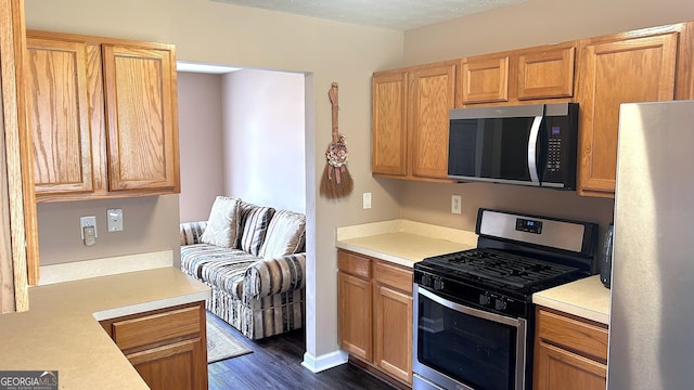 156 Roosevelt Blvd, Jackson, GA 30233 - kitchen with dark wood finished floors, stainless steel appliances, and light countertops
