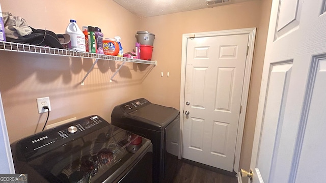 156 Roosevelt Blvd, Jackson, GA 30233 - clothes washing area with separate washer and dryer, dark wood-style flooring, visible vents, and laundry area